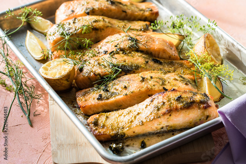 Konstfotografi six Roasted salmon steaks with fresh dill, lime.