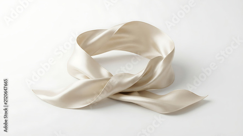 Scarf made of shimmering beige silk lies in an elegant knot on a pristine white studio background.
