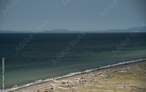 Hikers on Dungeness Spit Below Vancouver Island Mountains