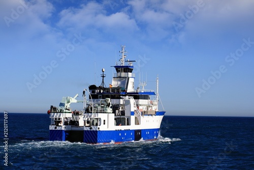 Fotografie Trauler fishing boat sailing along the Mediterranean coast of Spain