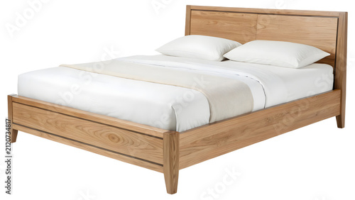 Bed frame made of light oak wood features a minimalist design with white linens and pillows, creating a comfortable and inviting atmosphere for a modern bedroom interior design project.