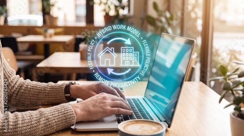 Professional working on laptop with holographic hybrid work model interface in cafe