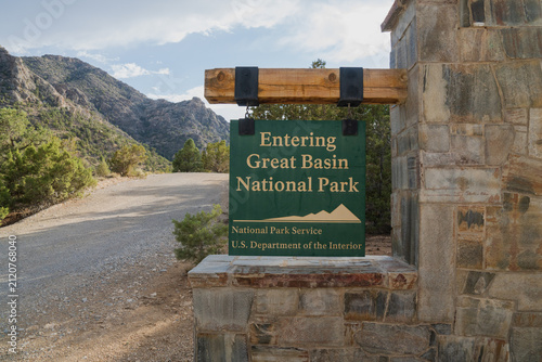 Wooden entrance sign reading 