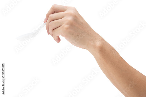 Male hand holding a white plastic spoon isolated on white background with a clipping path.