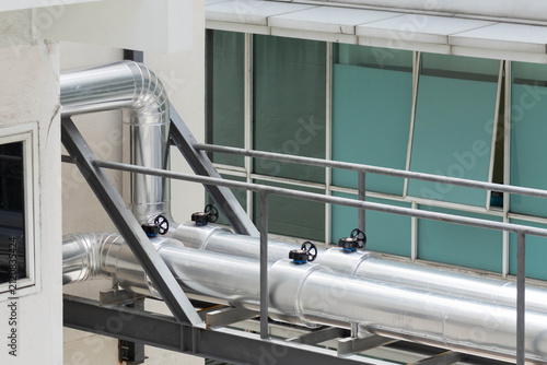 Photography Metal ventilation pipes on building roof