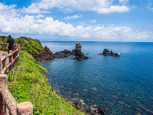 Volcanic Sea Stack and Red Oreum at Seopjikoji, Jeju Island