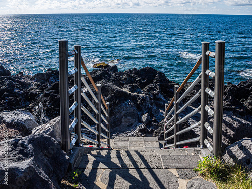 Stairway Leading Down to Volcanic Basalt Coast in Jeju City, South Korea