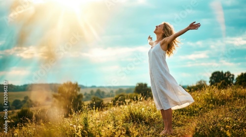 Free Happy Woman Enjoying Nature. Beauty Girl Outdoor. Freedom concept. Beauty Girl over Sky and Sun. Sunbeams. Enjoyment