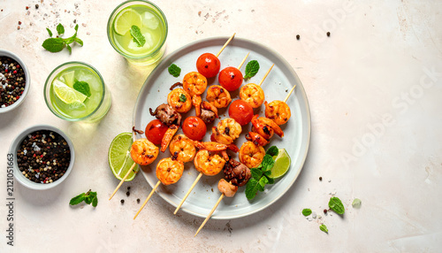 Delicious Grilled Shrimp and Cherry Tomato Skewers with Lime and Mint.