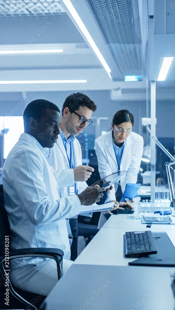 Fototapeta premium Diverse scientists collaborating in a modern laboratory setting.