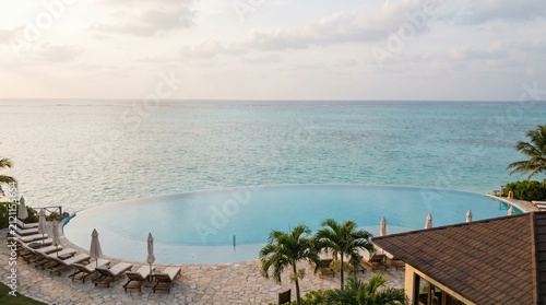 Resort Vacation Experience, Hospitality Industry Concept, Hotel Resort Business, Tropical Resort Pool Overlooking Serene Ocean View