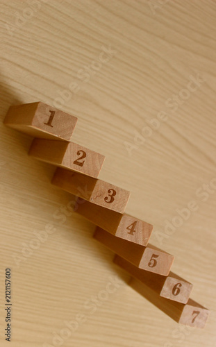 Obraz na plátne Metaphoric Staircase Made With Wooden Numbered Blocks In order