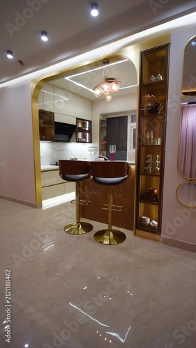 Modern luxury kitchen interior design. Contemporary home bar area with elegant gold accents.