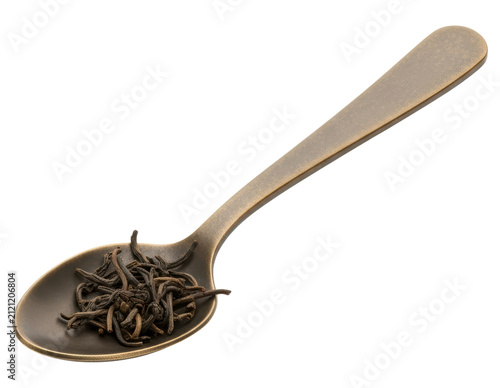 Dried black tea leaves on antique bronze spoon cut out on transparent background
