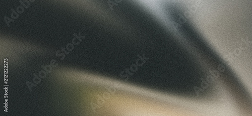 Dark black and charcoal flowing waves with muted golden highlights on grainy abstract background with soft fabric-like folds