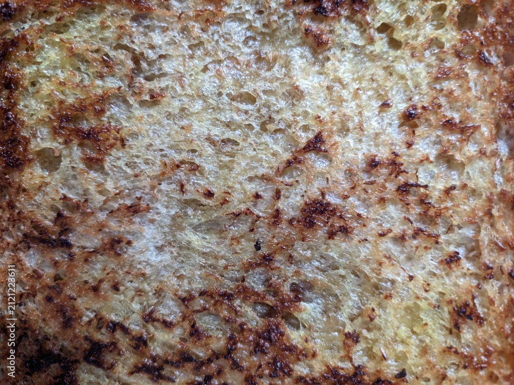 Naklejka premium toast taken from a top view, with a crispy texture in dim lighting