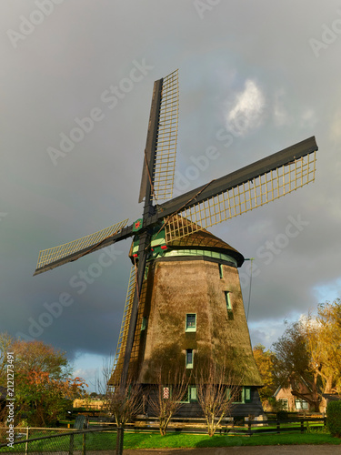 Fotografie Dutch windmill in Waarland Netherlands traditional architecture and cultural her
