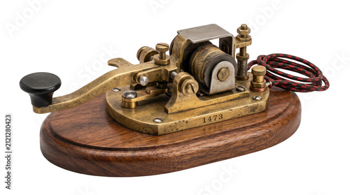 Vintage brass telegraph key on wooden base, antique morse code transmitter from 1873, retro telecommunication hardware for historical exhibits