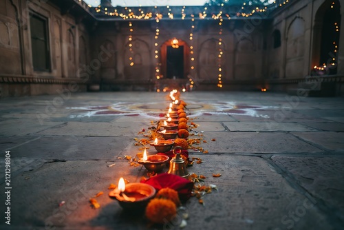 Row of Burning Oil Lamps Diyas in a Traditional Indian Courtyard for Diwali Festival