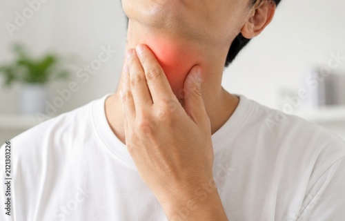 Man Suffering from Sore Throat and Thyroid Pain Touching His Neck