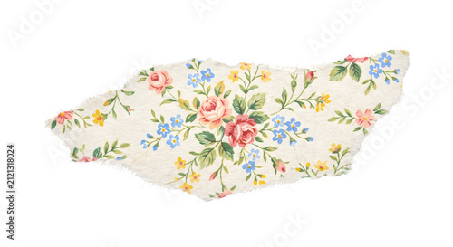 Torn handmade paper scrap with floral pattern
