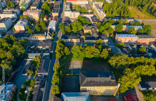 Aerial photo of a city Hämeenlinna in Finland with modern apartment buildings between trees, living in nature. 