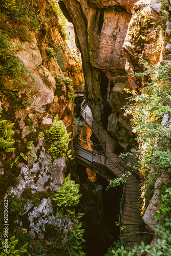 Atmospheric depth of the Bellano gorge seen from the wooden walkway trail