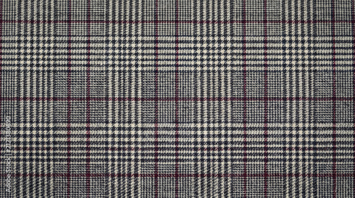 Classic plaid fabric texture with gray and burgundy grid pattern.