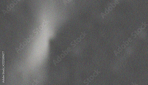 Canvastavla Dark dramatic grey grainy texture featuring a vertical bright light beam creatin