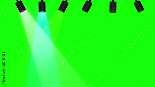 Stage spotlight fixture casting a light beam down against green screen
