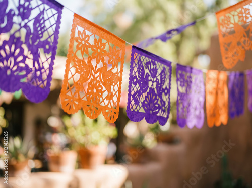Bright Colorful Papel Picado Paper Flags Hanging Outdoors under Sunlight