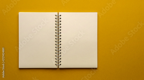 Blank Open Spiral Notebook on Yellow Background Flat Lay Mockup