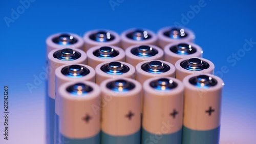 Several batteries neatly stacked in a vertical column