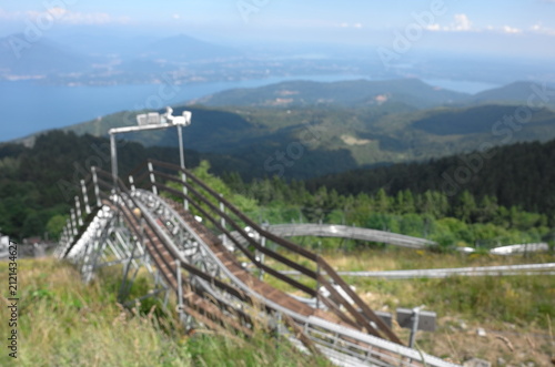 Obraz na płótnie Alpine summer toboggan track overlooking Lake Maggiore, Italy