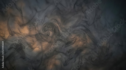 Black smoke swirls on dark background. Abstract ink clouds flowing in moody atmosphere.