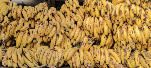 Фотография A banana is an elongated, edible fruit that is botanically a berry produced by several kinds of large treelike herbaceous flowering plants in the genus Musa