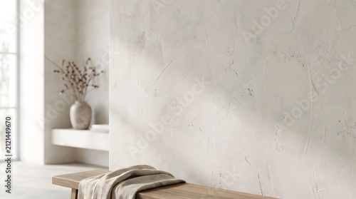 Interior space features a minimalist room with a textured white wall, a wooden bench, and a vase.