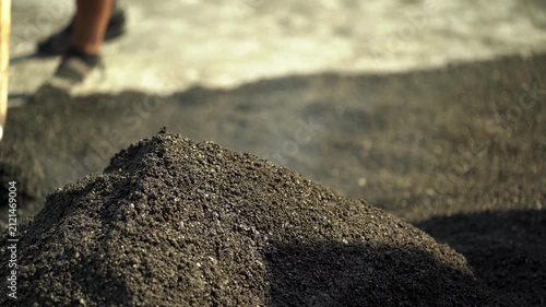 Steaming Pile of Hot Asphalt at a Road Construction Site