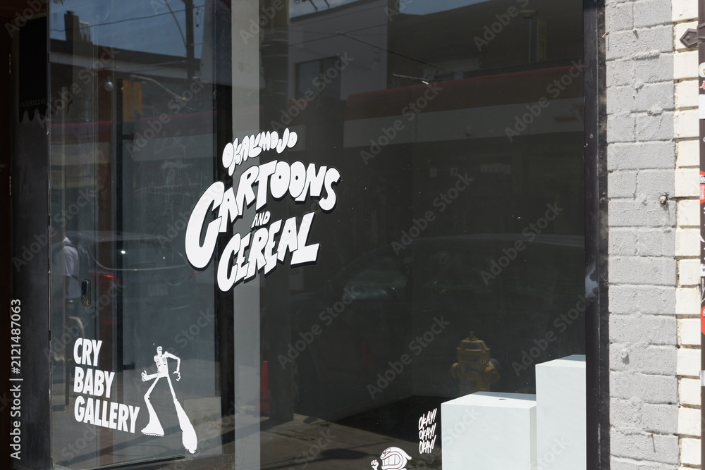 Fototapeta premium vinyl window signs at Cry Baby Gallery, a hidden speakeasy cocktail and oyster bar located behind an active art gallery at 1468 Dundas St W, Toronto
