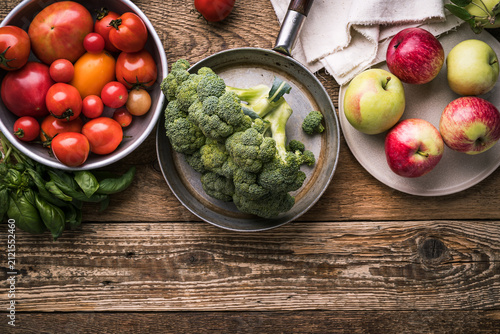 Картината върху платно Variety of homegrown organic vegetables and fruits for healthy cooking and eatin