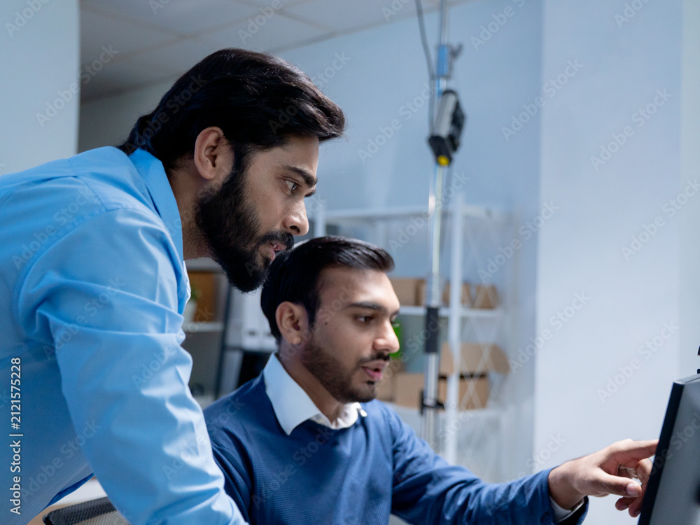 Fototapeta premium Team engineers software developers are brainstorming and using computer writing code to develop AI technology. Programmer using laptop work system about artificial intelligence and cyber security 