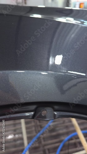 Close-up of metallic grey car paint finish with subtle glitter effect
