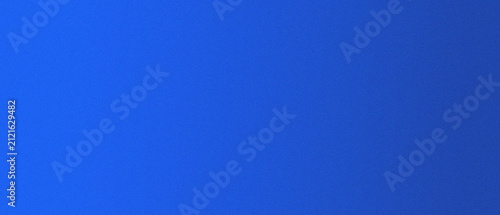 Fotografie Solid blue surface with subtle grain texture