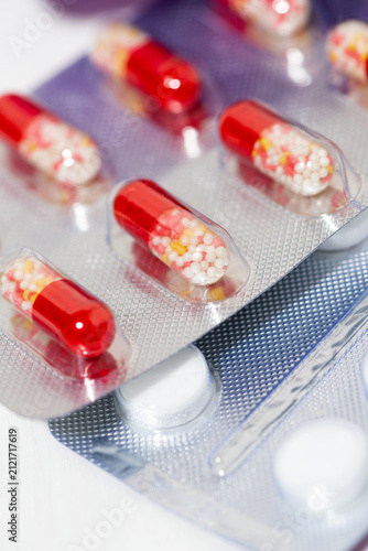 medications in tablets and capsules, closeup