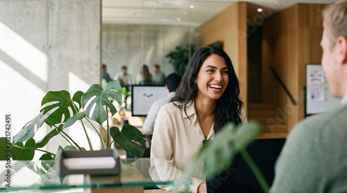 Business meeting between colleagues in a modern open office