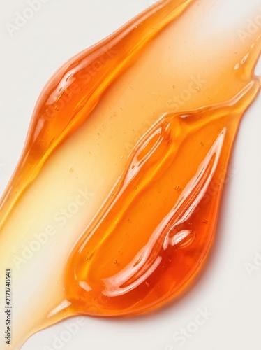 Vibrant orange translucent liquid texture with glowing ripples