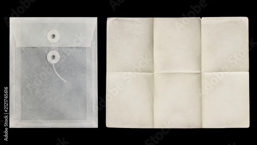 Blank translucent envelope and folded paper on black background