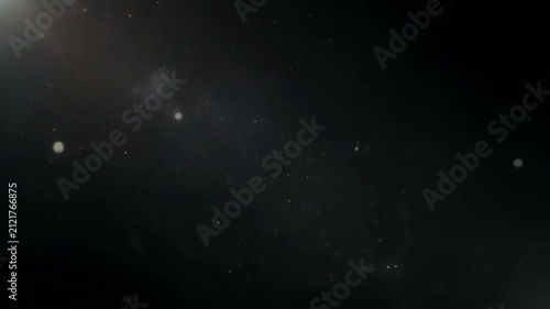 Cosmic Dust Particles drift in deep space nebula with subtle light flares and bokeh during a slow camera pan