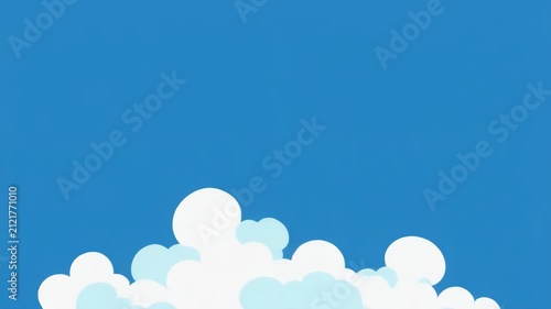 Fluffy white clouds drift across a clear blue sky during daytime