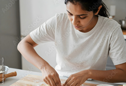 Young indian woman preparin...